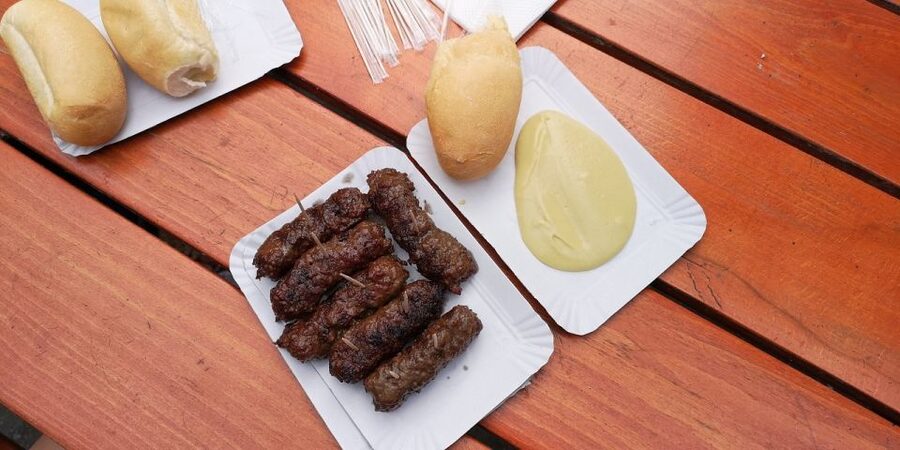 Bucharest: Street Food Tour with a Local Guide - Entering the tour at Lupa Capitolina and that pretzel-and-yogurt start